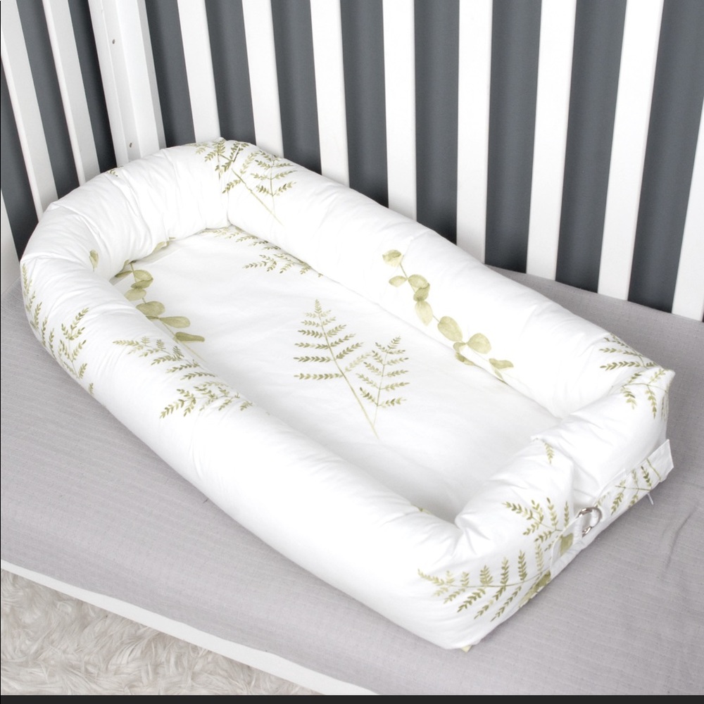 Baby or toddler nest, white with green leaves